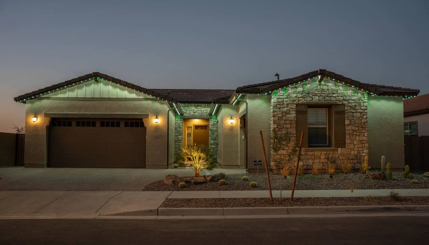 The same desert home lit in green and white for St Patricks Day